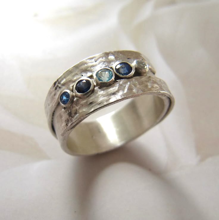 Silver ring inlaid with blue stones