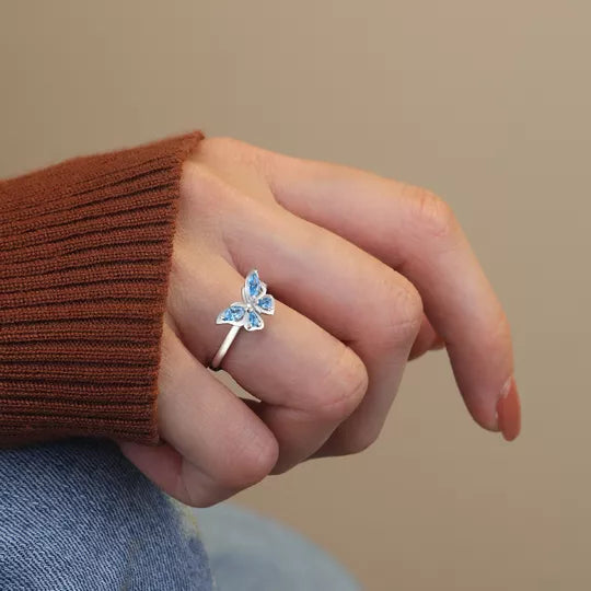 Adjustable rotating butterfly ring