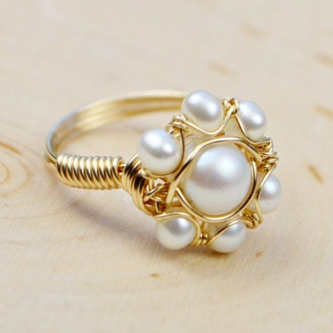 Ring with inlaid pearls