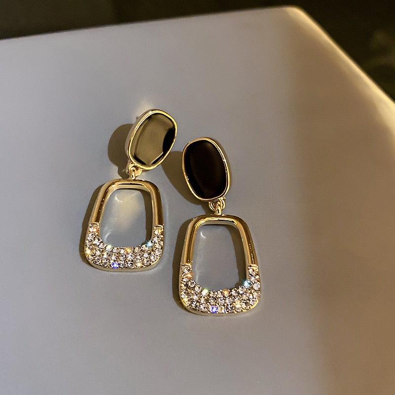 Luxury earrings with inlaid zircons