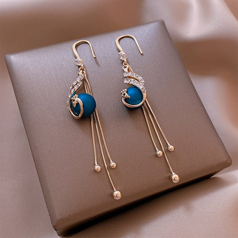 Party earrings with blue pearls