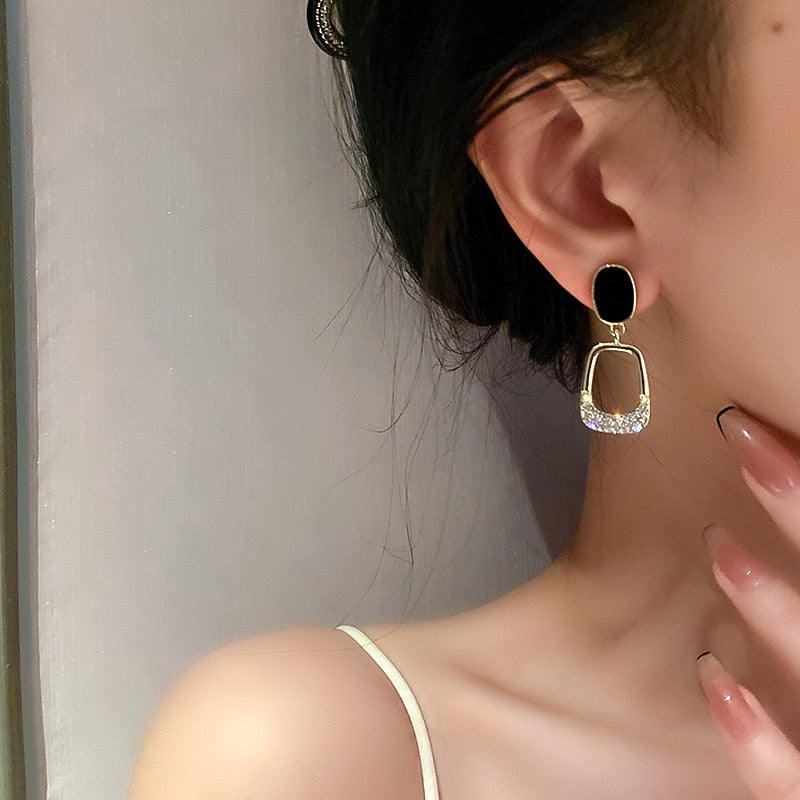 Luxury earrings with inlaid zircons