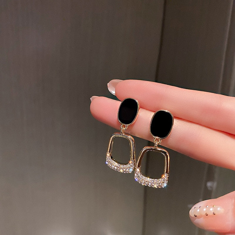 Luxury earrings with inlaid zircons