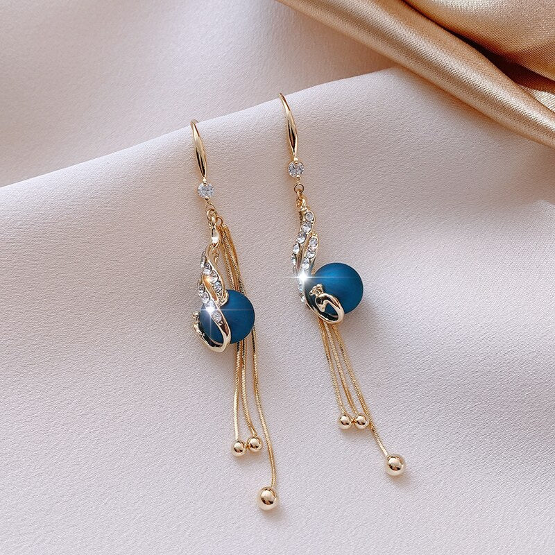 Party earrings with blue pearls