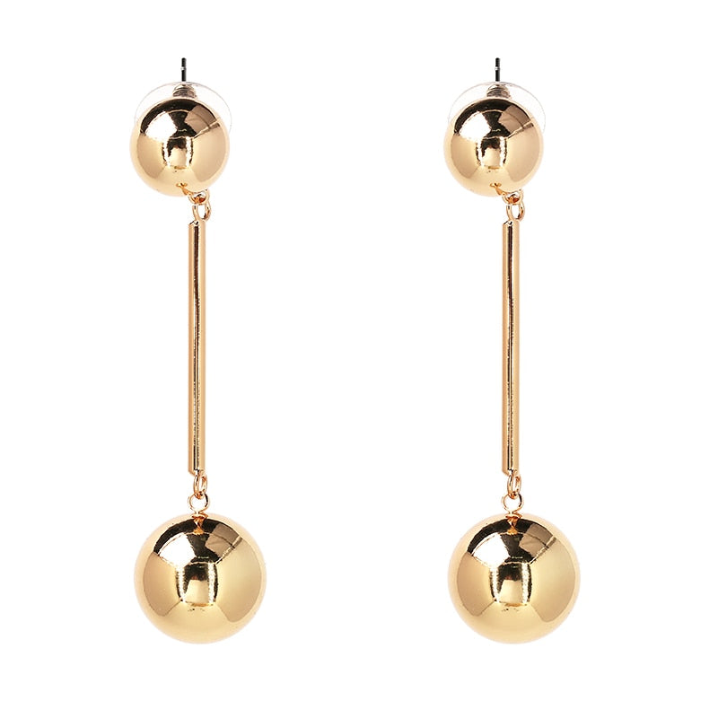 Long golden sphere earrings