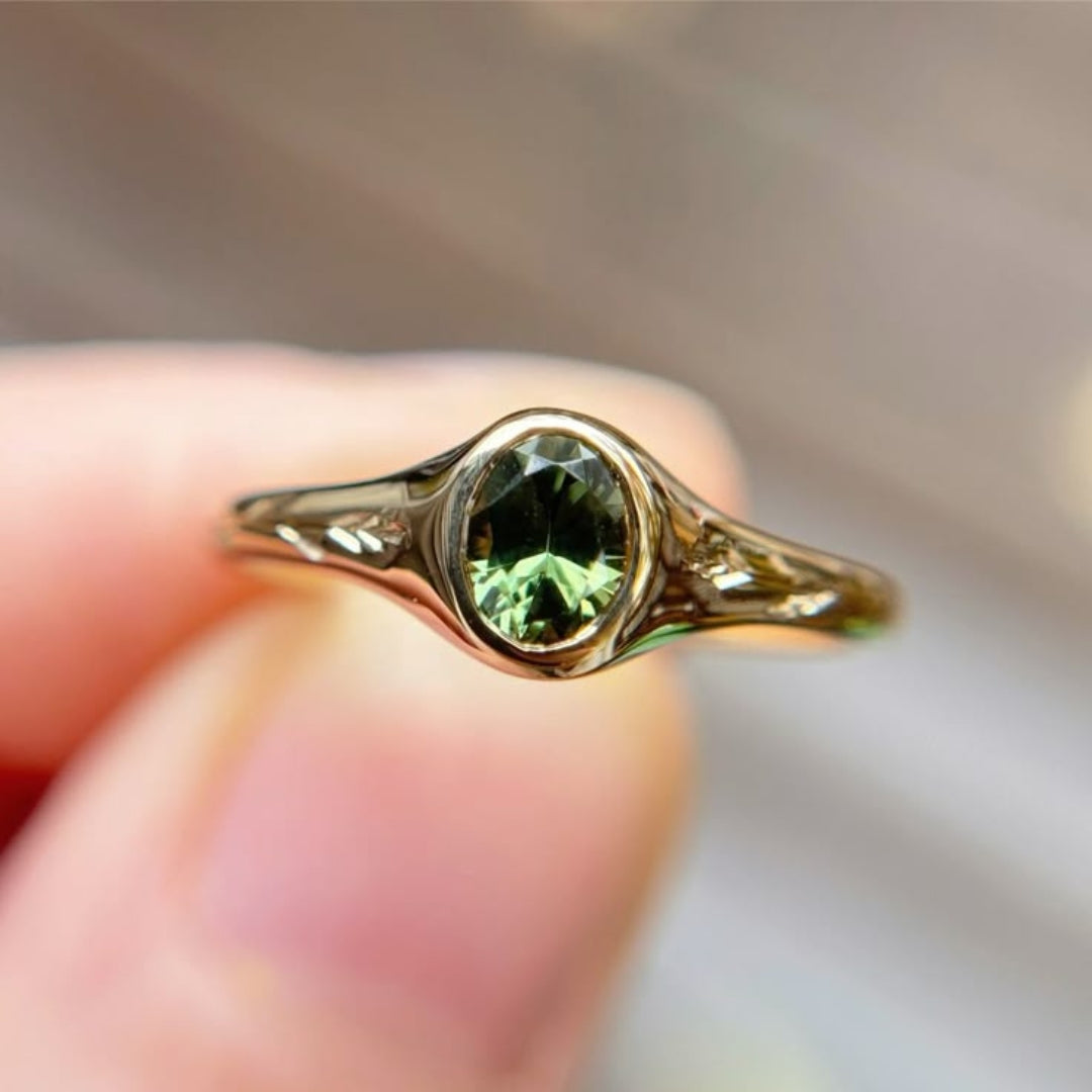 Ring with rounded green natural crystal