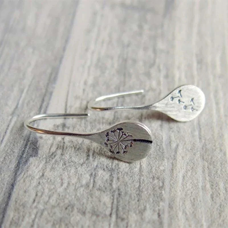 Silver lion leaf earrings