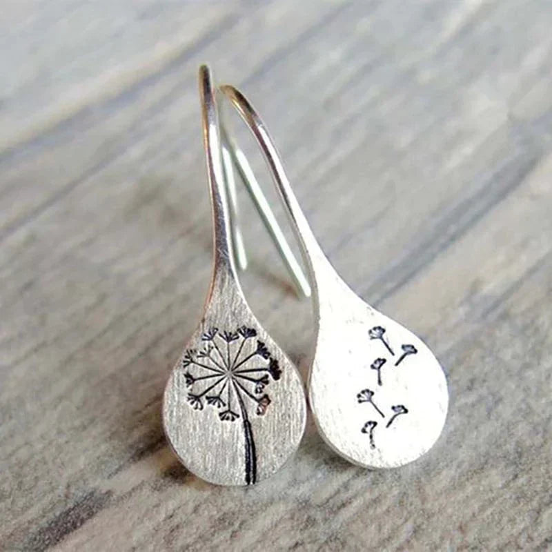 Silver lion leaf earrings