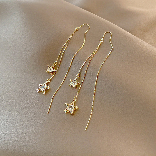 Star dangling earrings with crystals