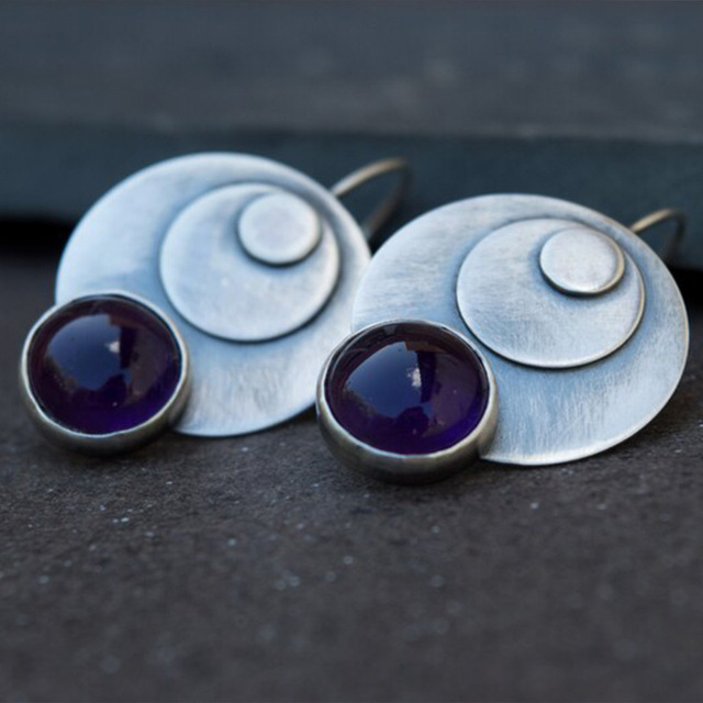 Double-plate earrings with purple stone