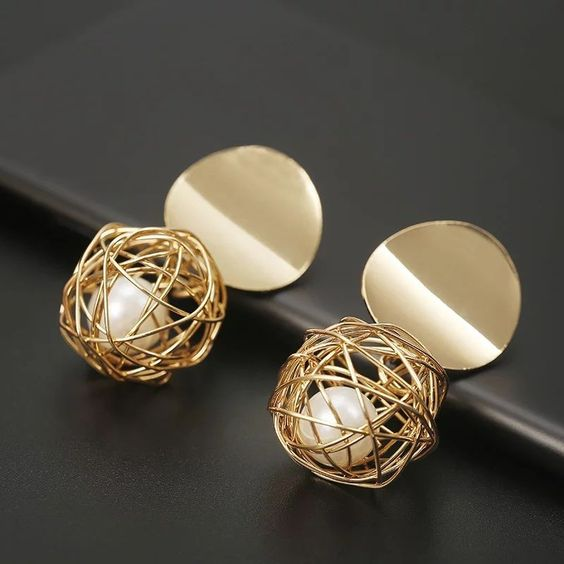 Sphere earrings with gold thread