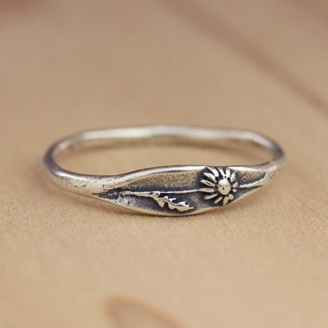 Silver ring with flowers