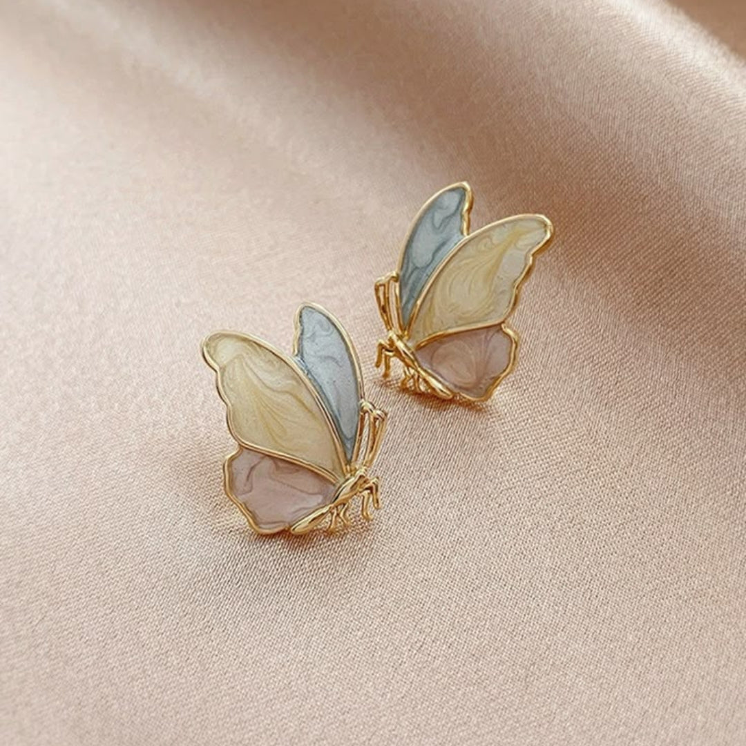 Golden earrings with colorful butterflies