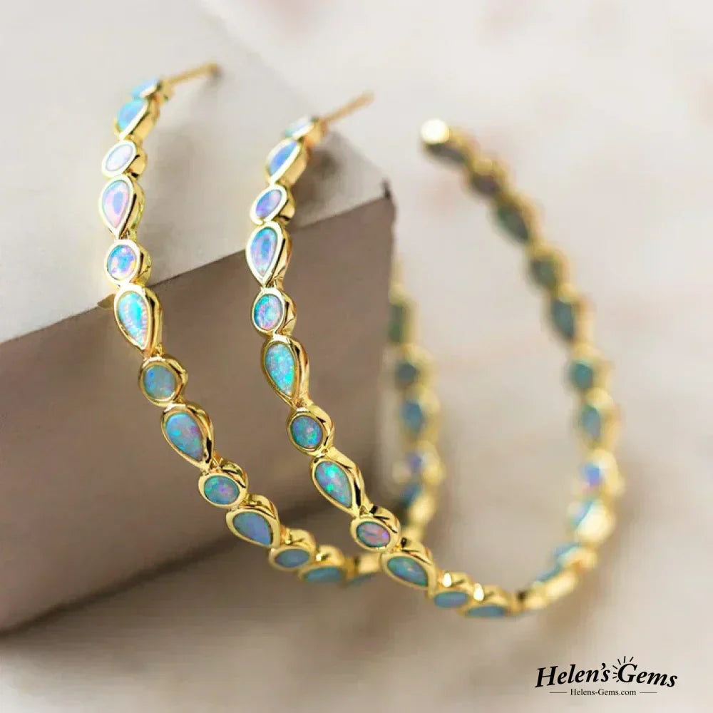 Gratia | Gold hoop earrings with blue opal