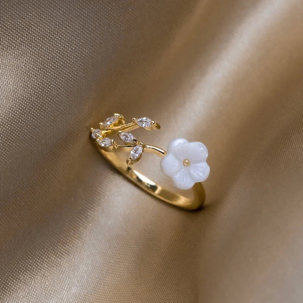 Adjustable white petal ring with zircons