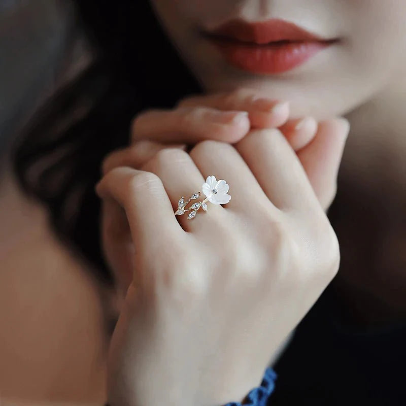 Adjustable white petal ring with zircons