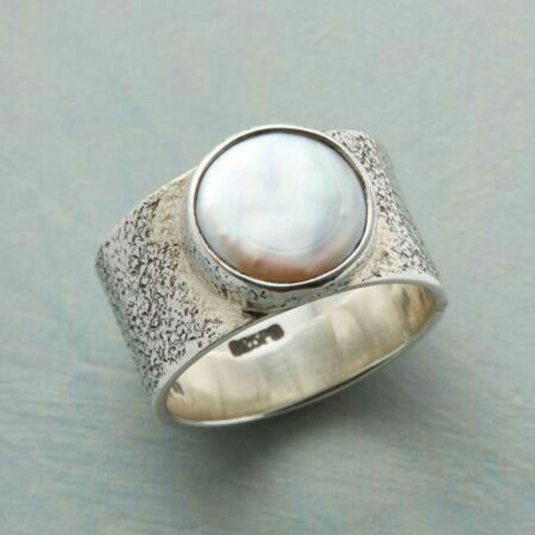 Ring with white stone