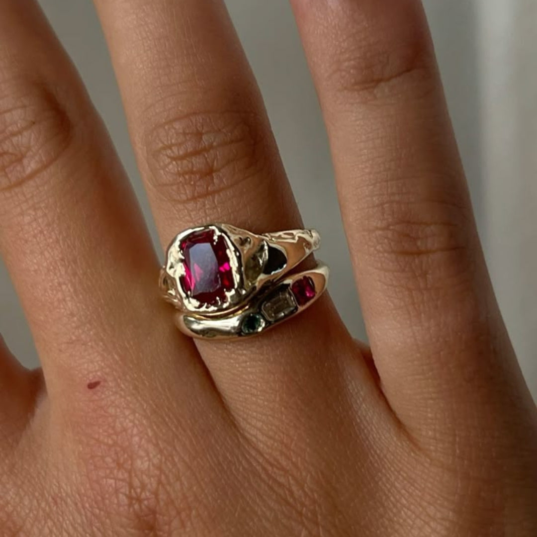 Forged ring with red stone