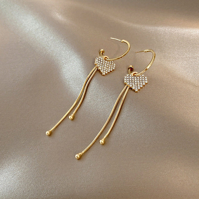 Golden heart earrings with crystals
