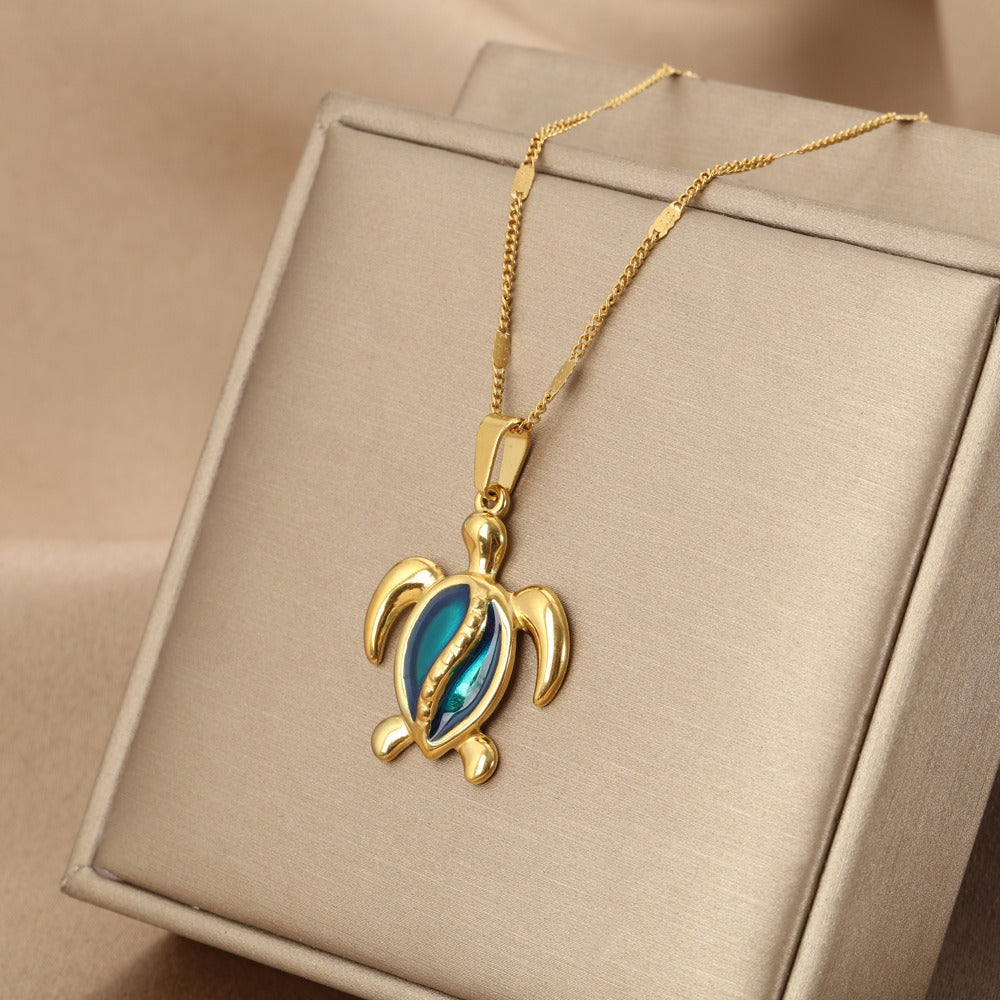Gold turtle necklace with gold shell and blue opal