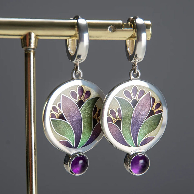 Earrings with purple crystal enamel