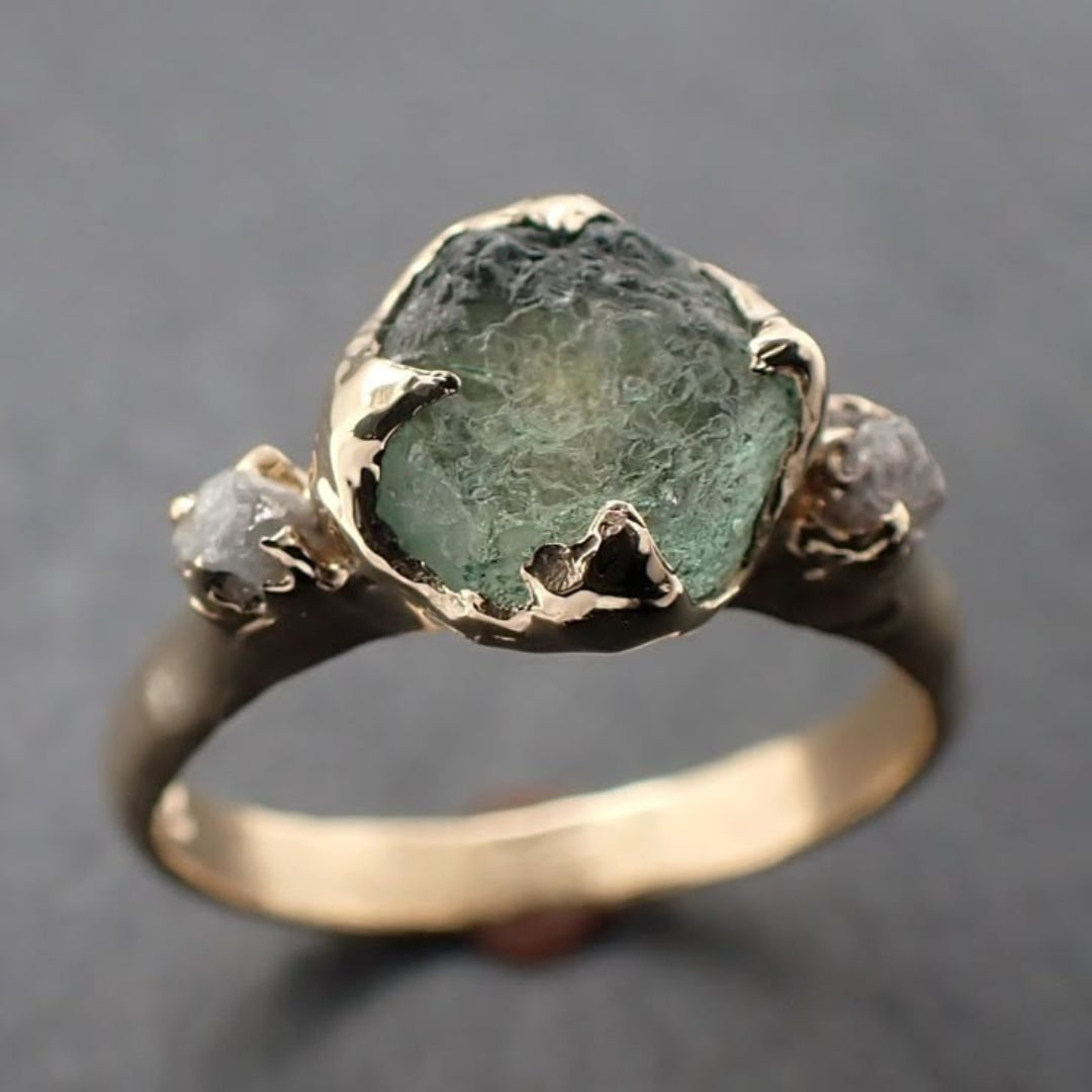 Forged ring with inlaid green stone
